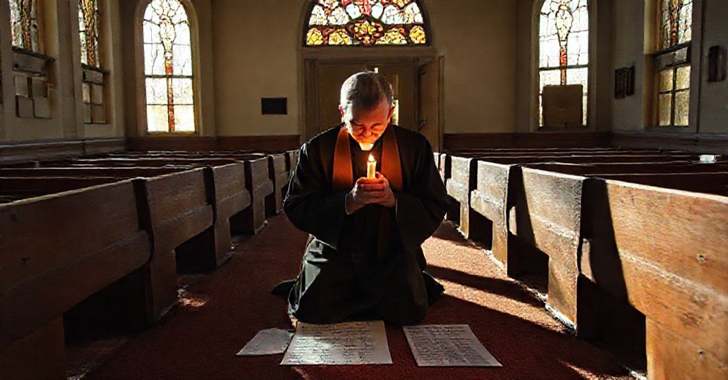 Traditional priest in prayer before abandoned Buffalo church symbolizing conciliar sect's temporalist failure