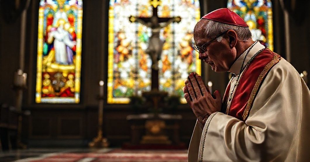 Catholic Bishop Praying for Christ's Kingship A Catholic bishop praying before a crucifix in a chapel, symbolizing devotion to the Kingship of Christ and rejection of modernist ecumenism.
