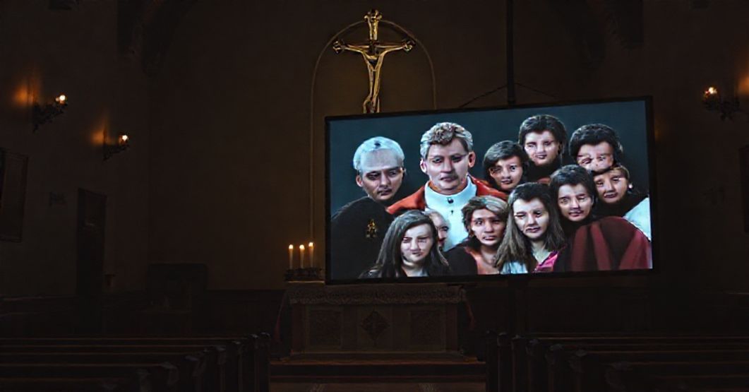 Digital Syncretism in Youth Evangelization A dimly lit chapel with a traditional Catholic altar contrasted by a digital screen displaying antipope Leo XIV in a staged dialogue with youth.