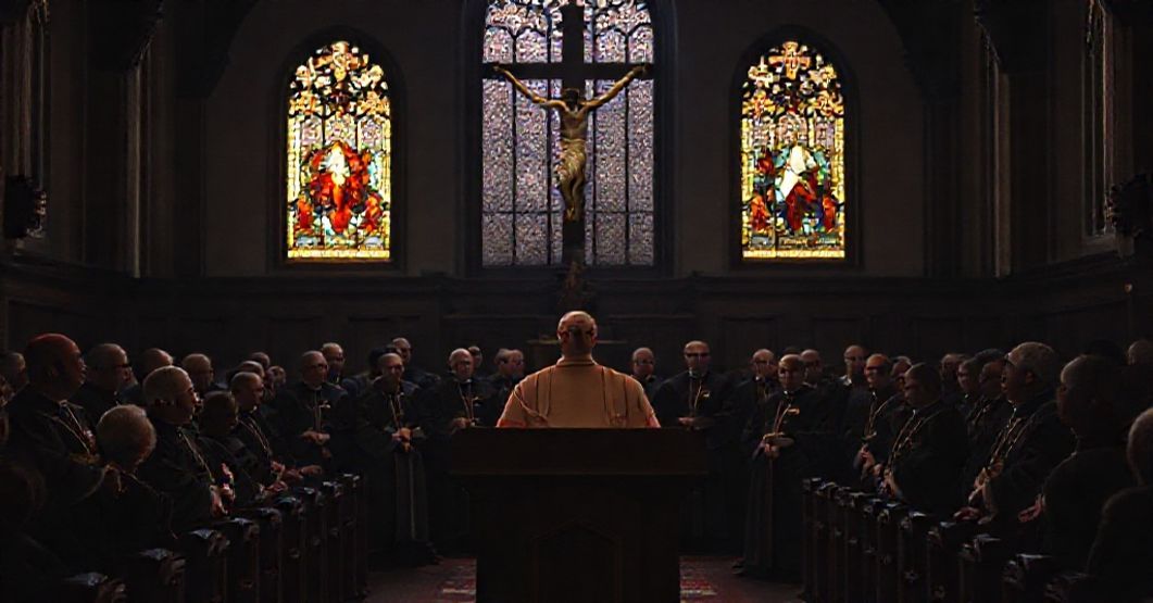 US Bishops Reject Christ's Social Kingship in Immigration Statement US Bishops in a dimly lit church discussing immigration statement without reference to Christ's Social Kingship